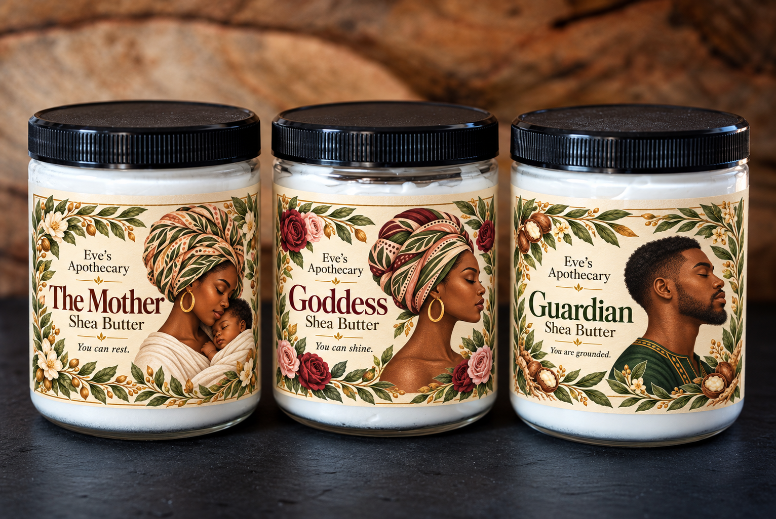 Packaging mockup of The Mother, Goddess, and masculine Guardian labels on three clear shea butter jars with black lids
